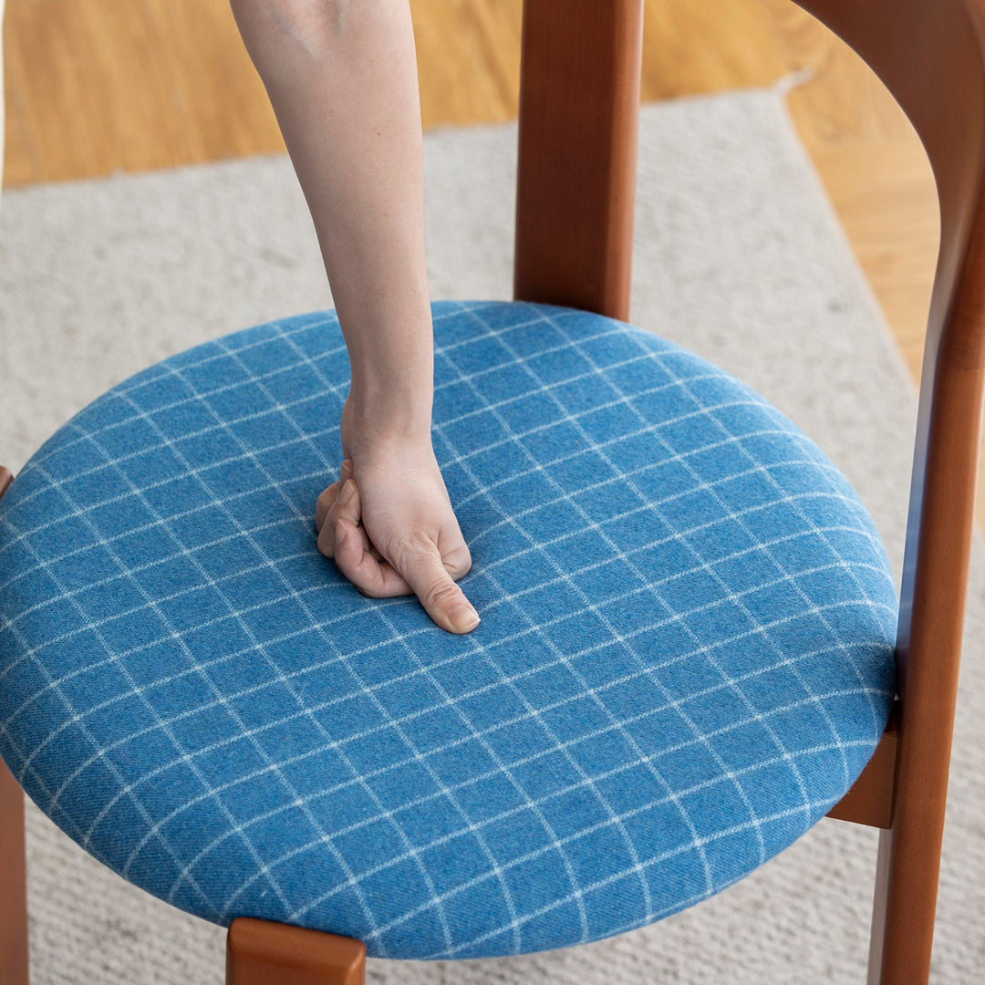 Bauhaus wool fabric beech wood dining chair memphis in real life style.