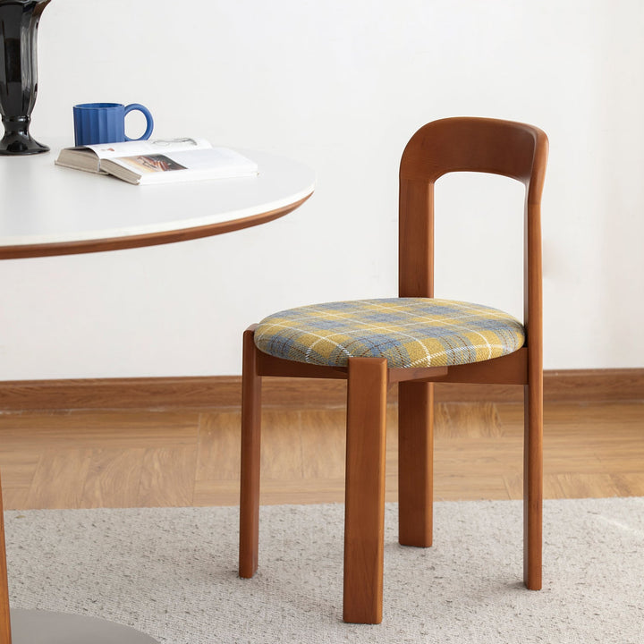 Vintage wool fabric beech wood dining chair memphis in close up details.