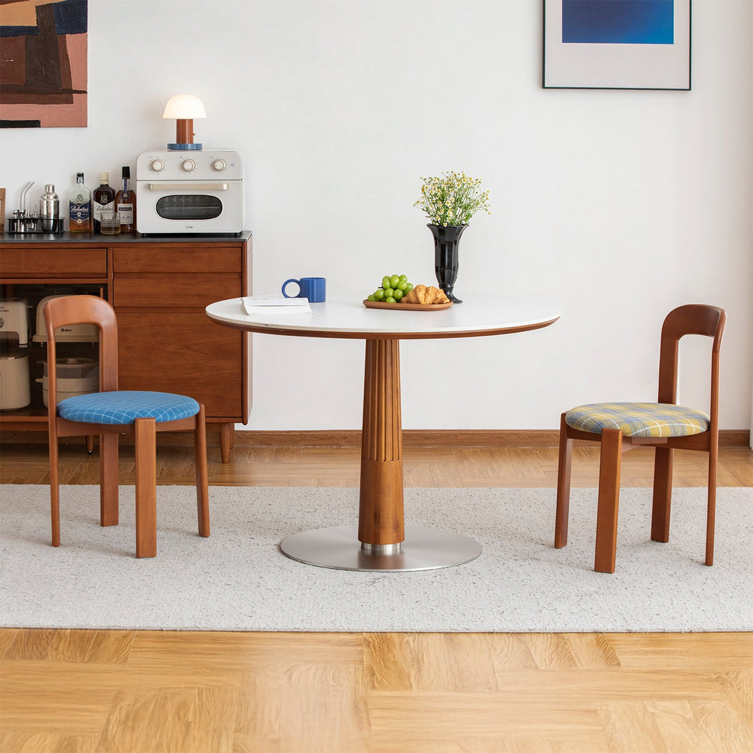 Vintage wool fabric beech wood dining chair memphis in still life.